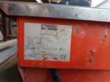 a label on the back of a machine that is sitting on a table