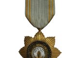 une image représentant une médaille ornée d'une étoile dorée