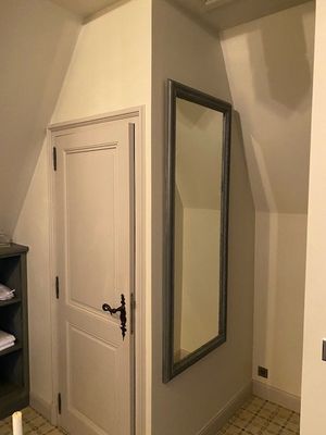 a bathroom with a sink and a mirror in it