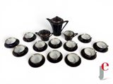 a lot of cups and saucers on a white table