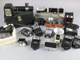 a lot of old cameras and other items on the table