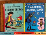 several children ' s books are stacked on a shelf in front of each other
