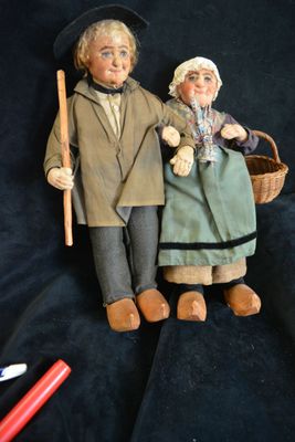a couple of dolls that are standing next to each other