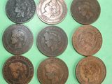six different types of british coins on a green surface