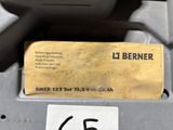 a label on the side of a machine that has a tag attached to it