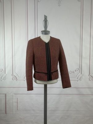 an image of a mannequin with a jacket on a mannequin stand