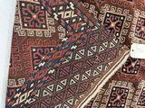 a close up of a rug with a tag on it