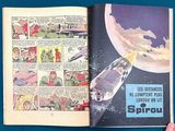 someone is holding a comic book open to a page with an image of a space shuttle