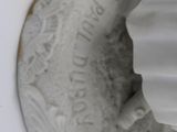 a close up of a white object on a white surface