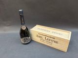 an image of a bottle of champagne next to a wooden box