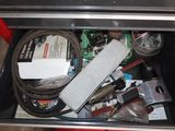 a drawer full of assorted items in a kitchen