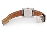 an image of a wrist watch with a leather strap on a white surface