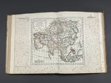 an old book with a map of asia on it