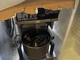 a box on top of a stand with a mixer in it