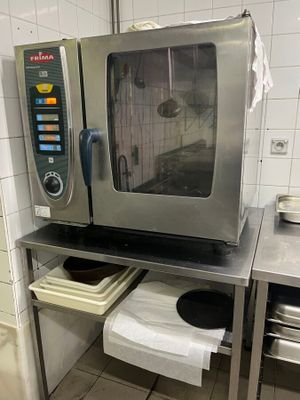 a microwave that is sitting on a table in a kitchen