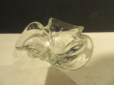 a glass bowl that is sitting on a table