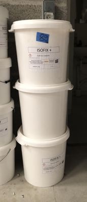 several buckets of food are stacked on top of each other in a garage