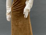 an image of a mannequin wearing a brown skirt and a white blouse