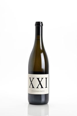 an image of a bottle of wine sitting on top of a white table