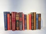 many old books lined up on a white surface