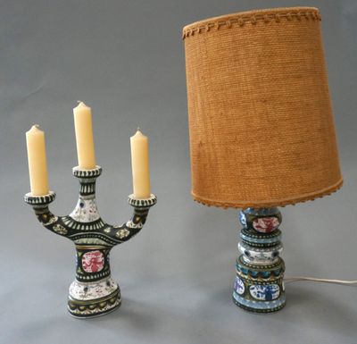 a lamp that is next to a candelier with candles on it
