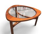 an oval coffee table with a glass top and wooden legs
