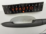 a close up of a car door handle with a measuring tape on it