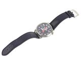a close up of a watch on a white surface with a white background