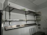 a metal shelf that is hanging from the ceiling