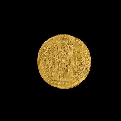 une pièce d'or sur laquelle est représenté un groupe de personnes