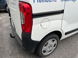 a white van that is parked in a parking lot
