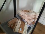 a stack of folded towels on a shelf in a room