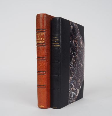 two books sitting next to each other on a white surface