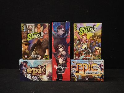 four games are lined up in a row on a black surface