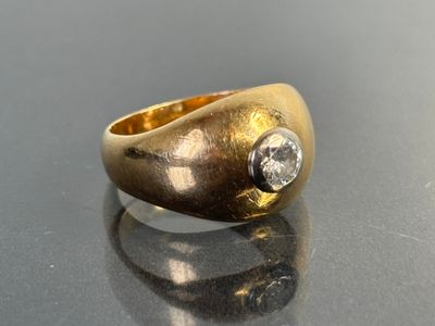 an image of a gold ring with a diamond on it