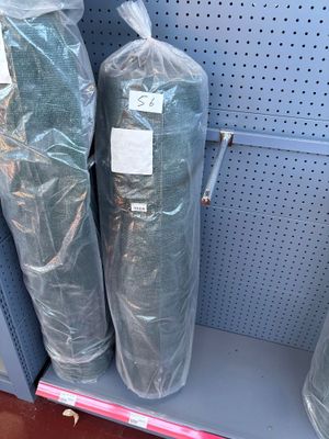 two bags of toilet paper on the shelf