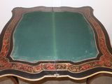 a table that has a green table top on it