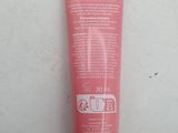 a close up of a tube of cream on a white surface