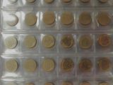 a lot of coins that are in a plastic box