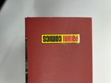 a red book with a yellow sticker on it