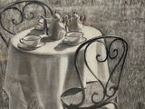 a drawing of a table and chairs in a field