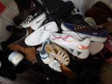 many pairs of shoes that are sitting in a basket