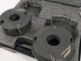 two circular cutters in a case on a table