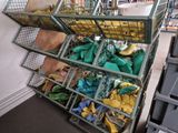a large metal cage filled with green and yellow items