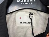 an image of a close up of a sweater on a hanger