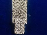 a close up of a watch on a blue surface