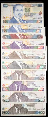 several bills with a picture of a man in a suit and tie
