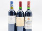 trois bouteilles de vin posées l'une à côté de l'autre sur une table