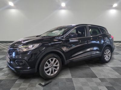 a black suv is parked on a checkered floor in a garage