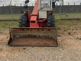 a tractor that is sitting in the dirt